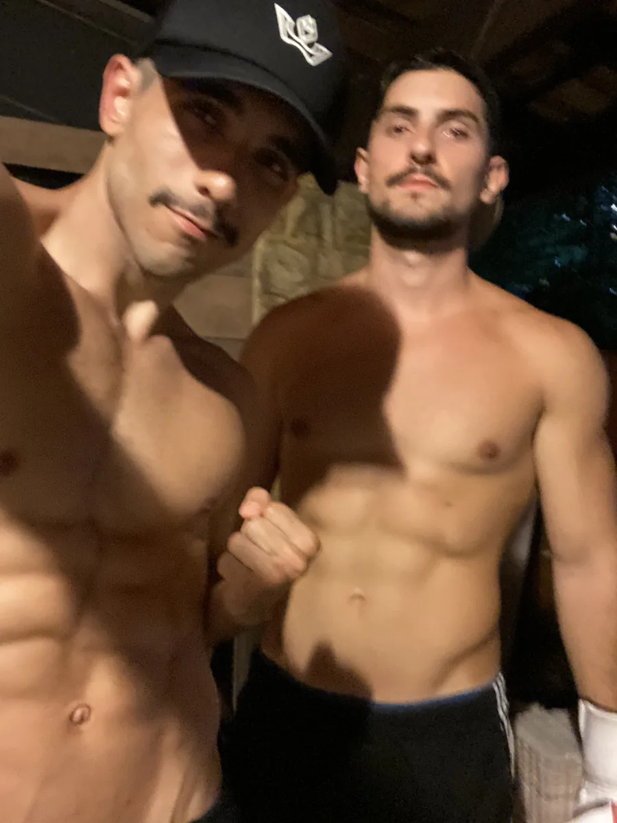 Raphael and a client taking a selfie after a session